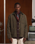 Veste en tweed de laine verte à chevrons